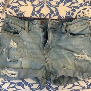 light blue jean shorts with rips